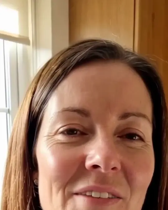 An AI-generated woman talking to the camera in a kitchen, from one of our ads, with her mouth clearly visible